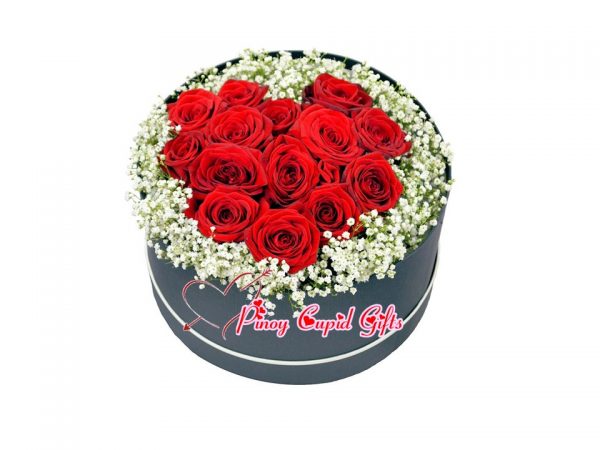 Red Roses with imported fillers in a Round Box