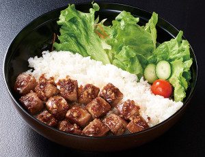 Rice topped with diced beef garlic steak.
