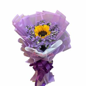 Single Sunflower and purple dried gypso in a bouquet